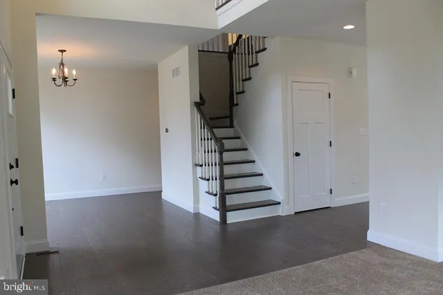 a view of entryway with wooden floor