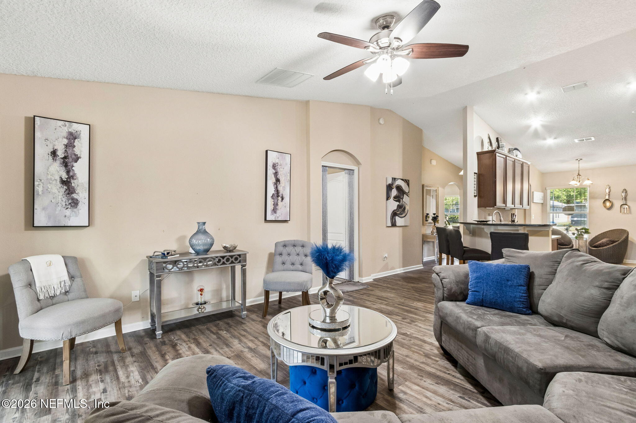 96034 Bass Lane Yulee, FL 32097 - Photo 16 of 50 a living room with furniture and a dining table