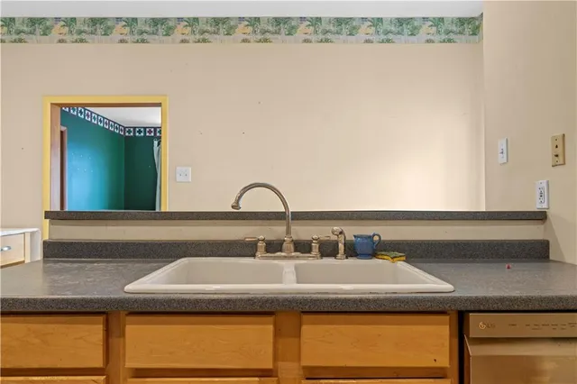 a bathroom with a sink and a mirror