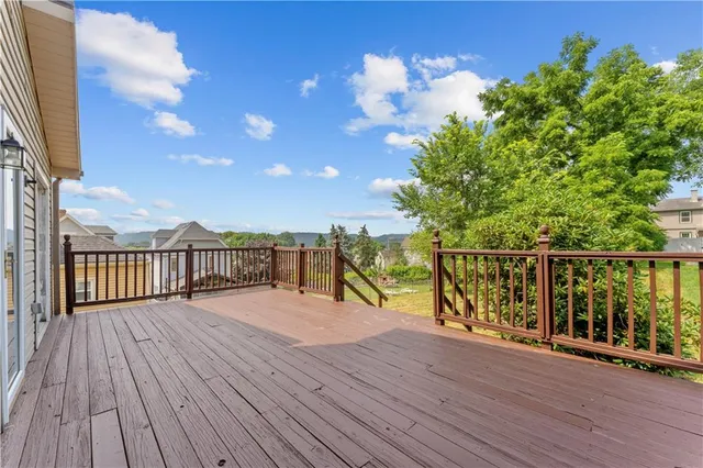 a view of balcony with deck and wooden floor
