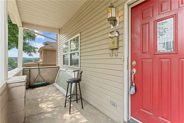 a view of a patio with table and chairs and potted plants