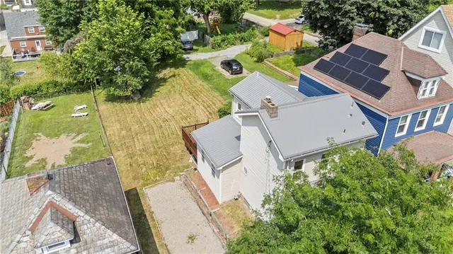 an aerial view of house with yard