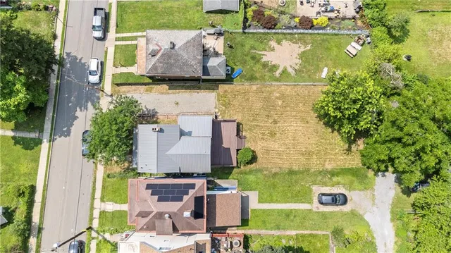 aerial view of a house with a garden and plants
