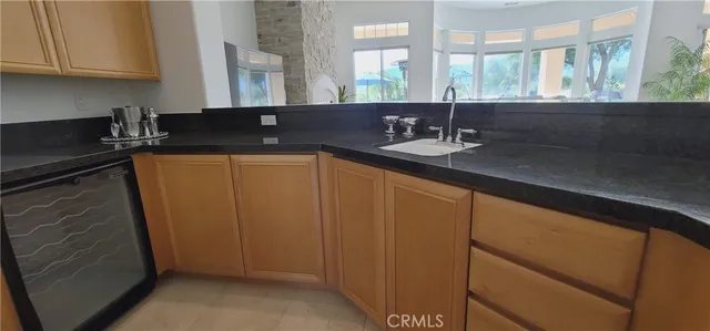 a view of a a dining room with furniture window and wooden floor
