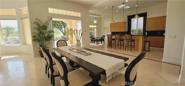an open kitchen with a table and chairs