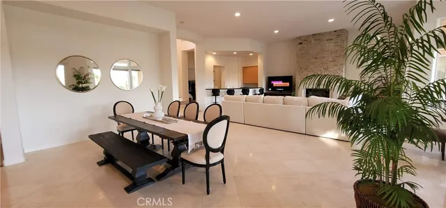 a view of a workspace area with a table and chairs