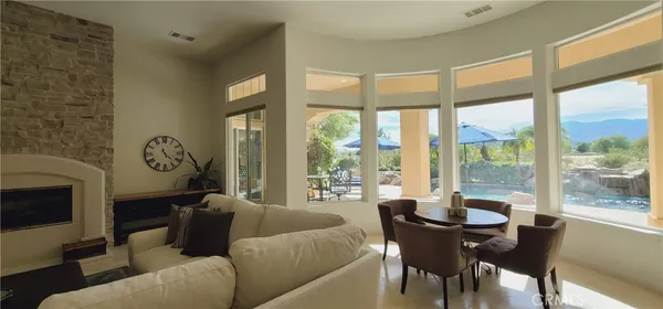 a bedroom with furniture and a flat screen tv