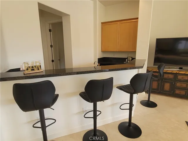 a bedroom with a bed window and a mirror