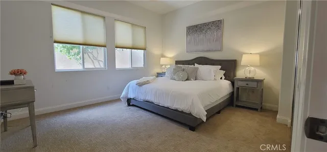a bathroom with a sink a mirror and a shower