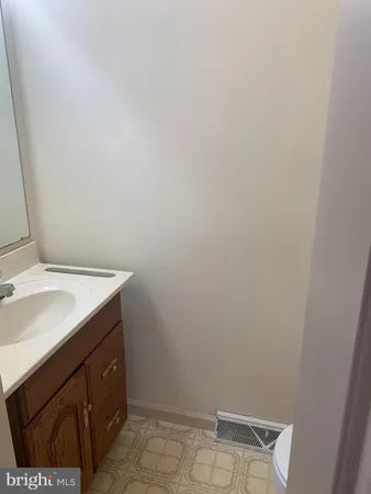 a bathroom with a sink and vanity