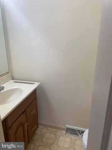 a bathroom with a sink and vanity