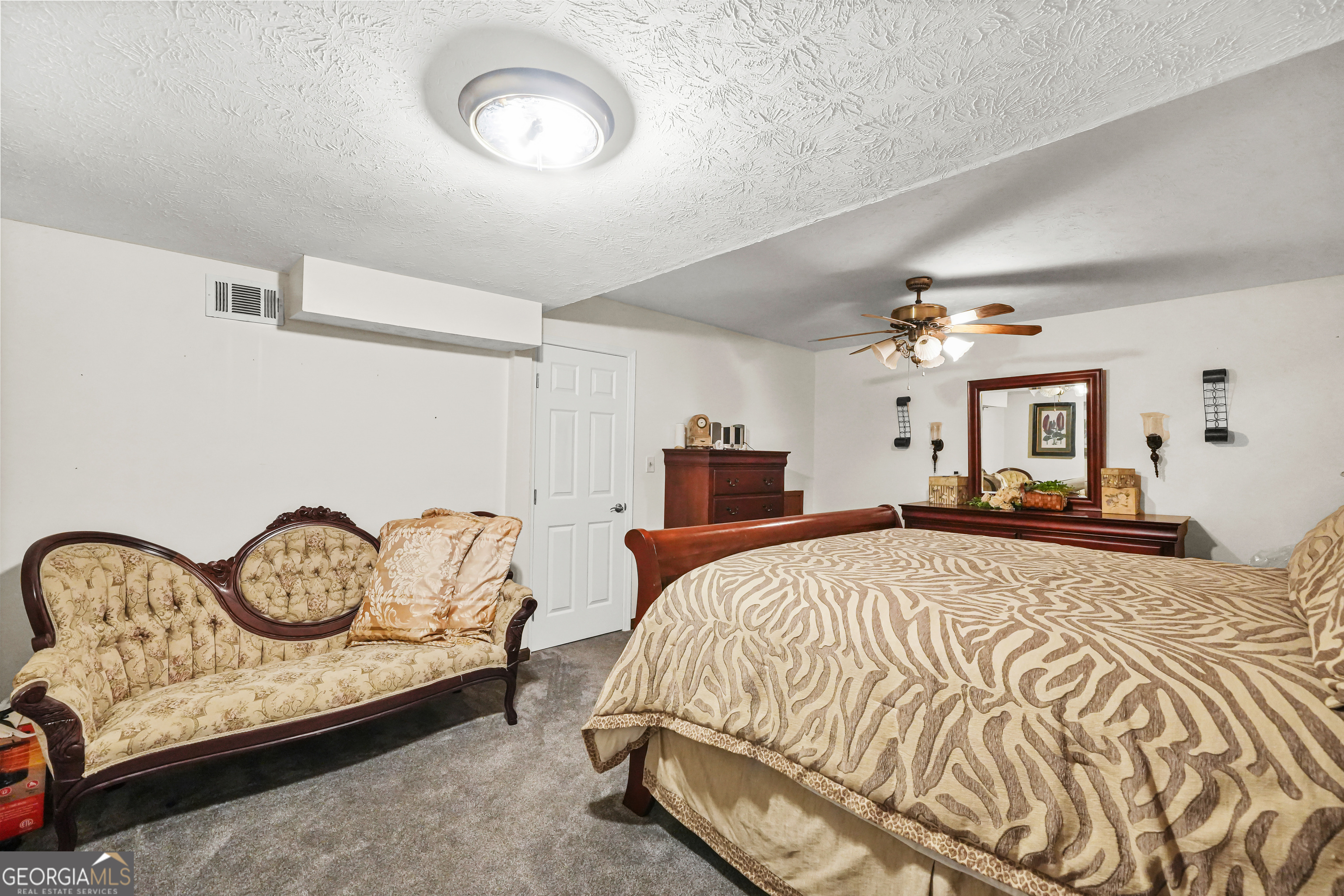 3111 Octavia Lane Snellville, GA 30039 - Photo 18 of 42 a bedroom with a bed mirror and a window