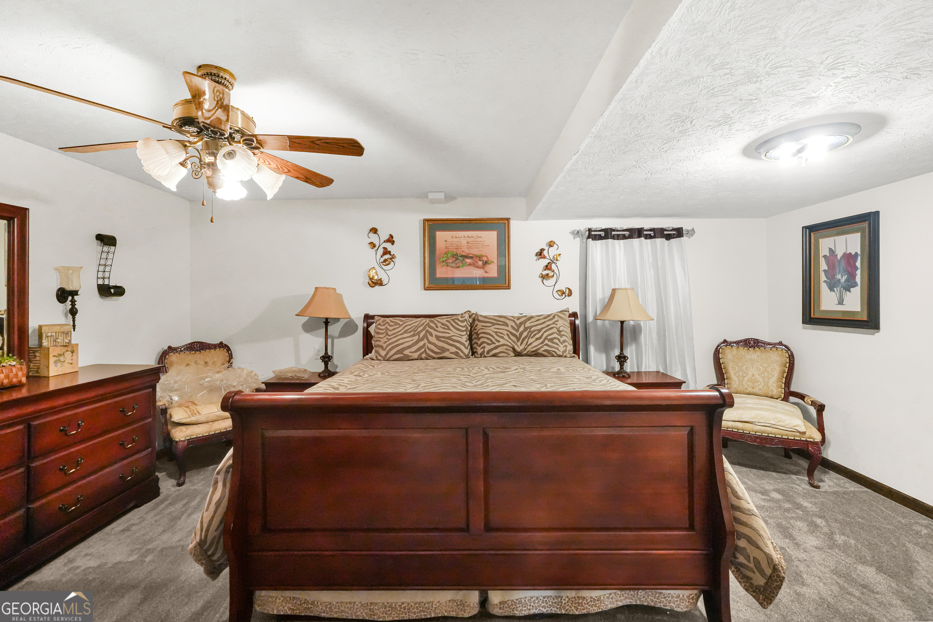3111 Octavia Lane Snellville, GA 30039 - Photo 25 of 42 a bedroom with a bed and a chandelier