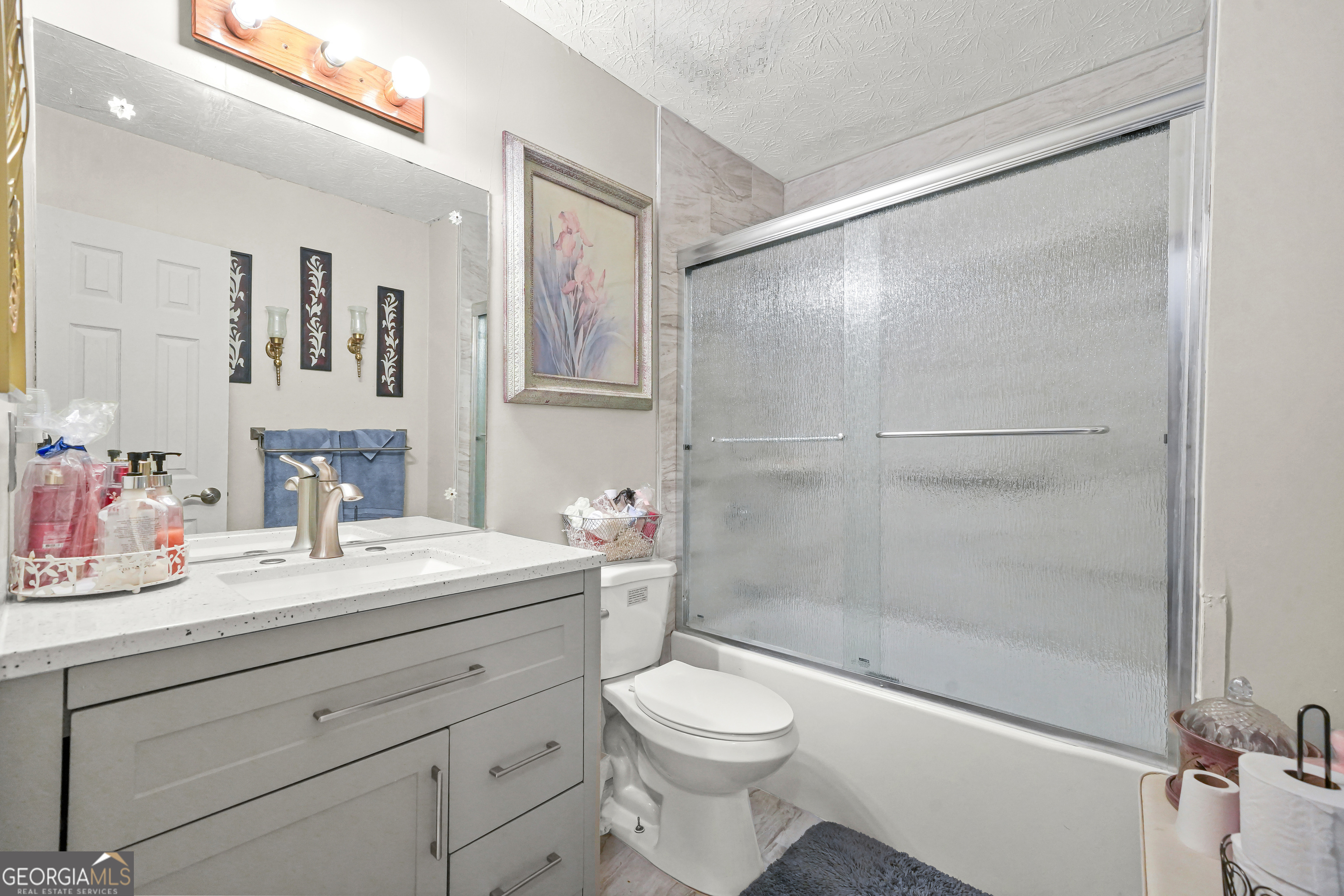 3111 Octavia Lane Snellville, GA 30039 - Photo 28 of 42 a bathroom with a sink a toilet and shower