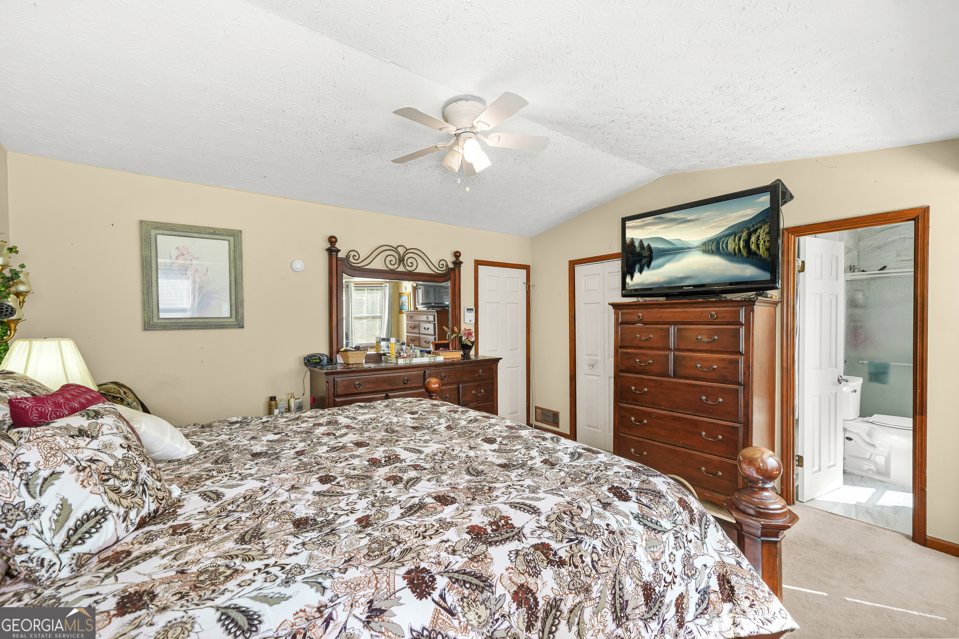 3111 Octavia Lane Snellville, GA 30039 - Photo 31 of 42 a bedroom with a bed and a dresser