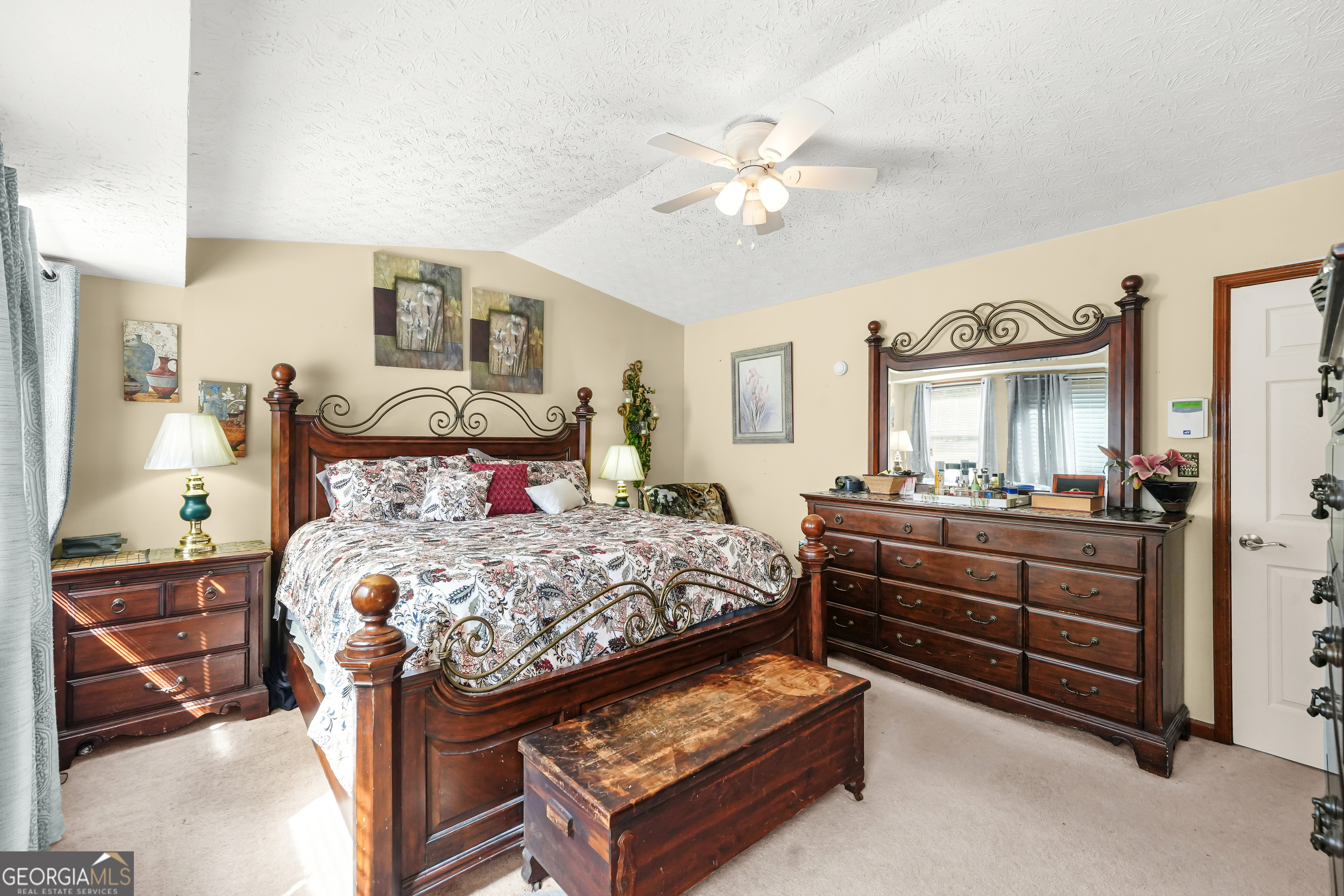 3111 Octavia Lane Snellville, GA 30039 - Photo 32 of 42 a bedroom with a bed and a chandelier