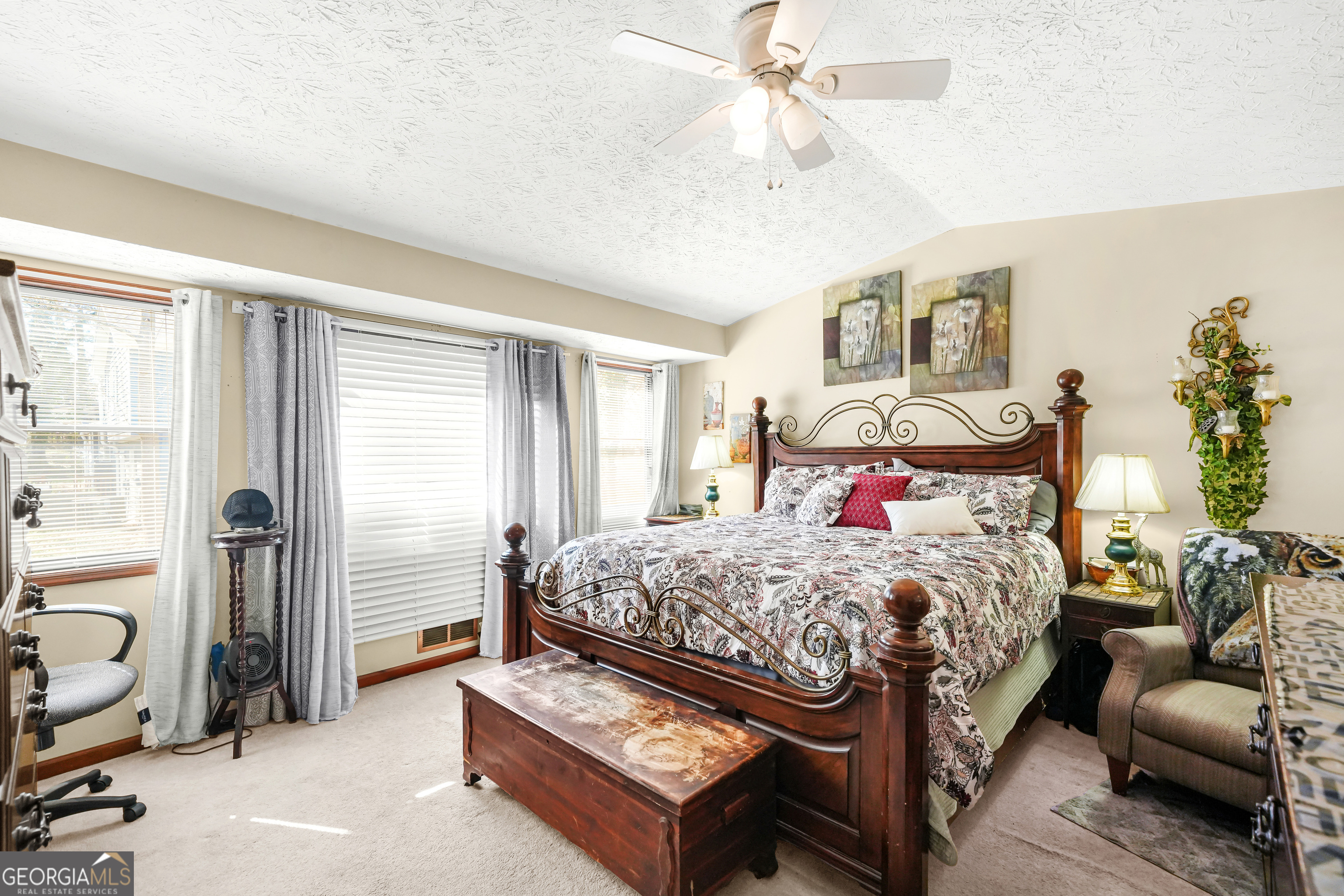 3111 Octavia Lane Snellville, GA 30039 - Photo 33 of 42 a bedroom with a bed and a chandelier