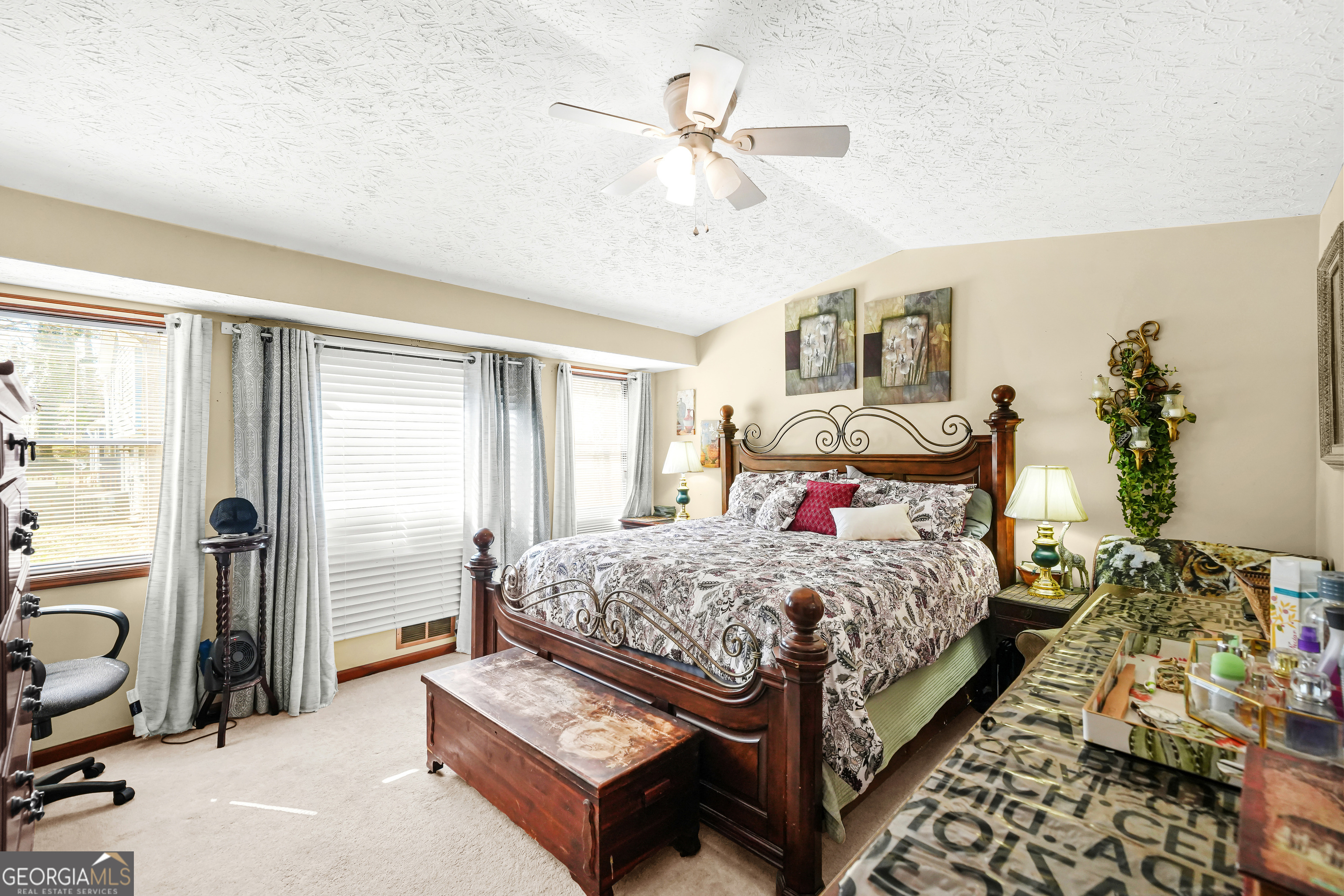 3111 Octavia Lane Snellville, GA 30039 - Photo 34 of 42 a bedroom with a bed and ceiling fan