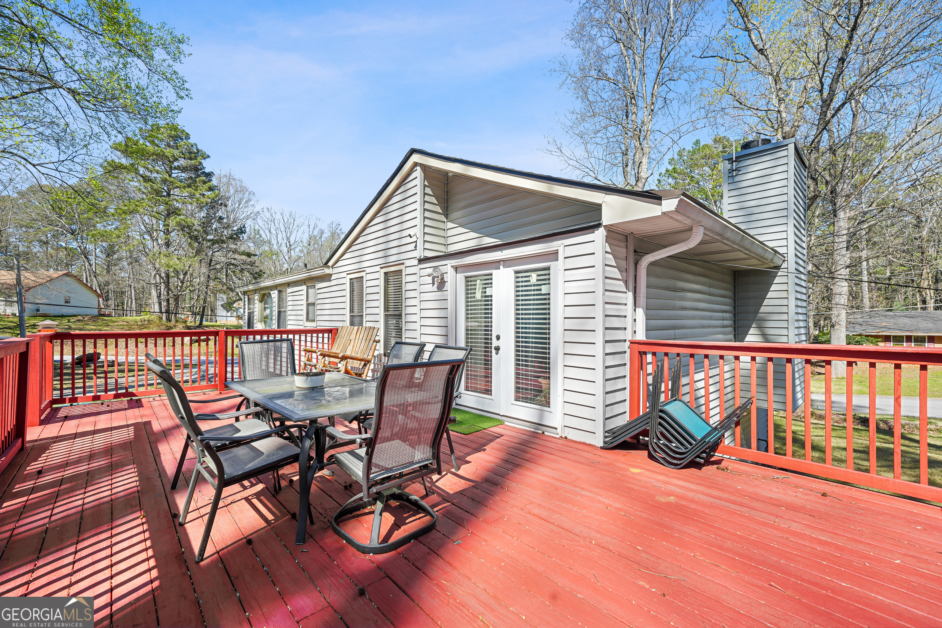 3111 Octavia Lane Snellville, GA 30039 - Photo 37 of 42 a view of a patio with a table chairs and wooden fence