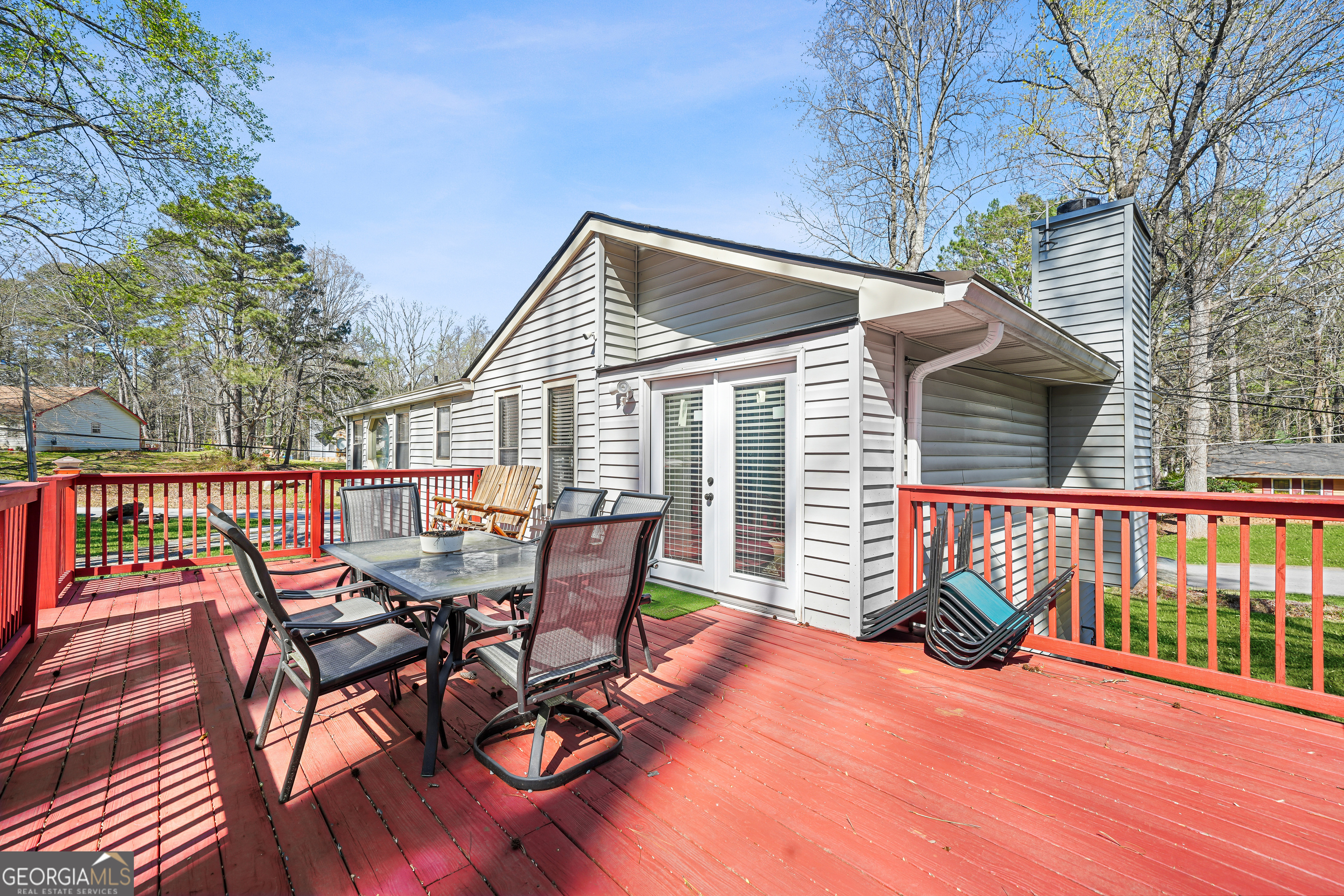 3111 Octavia Lane Snellville, GA 30039 - Photo 39 of 42 a view of a patio with a table chairs and wooden fence