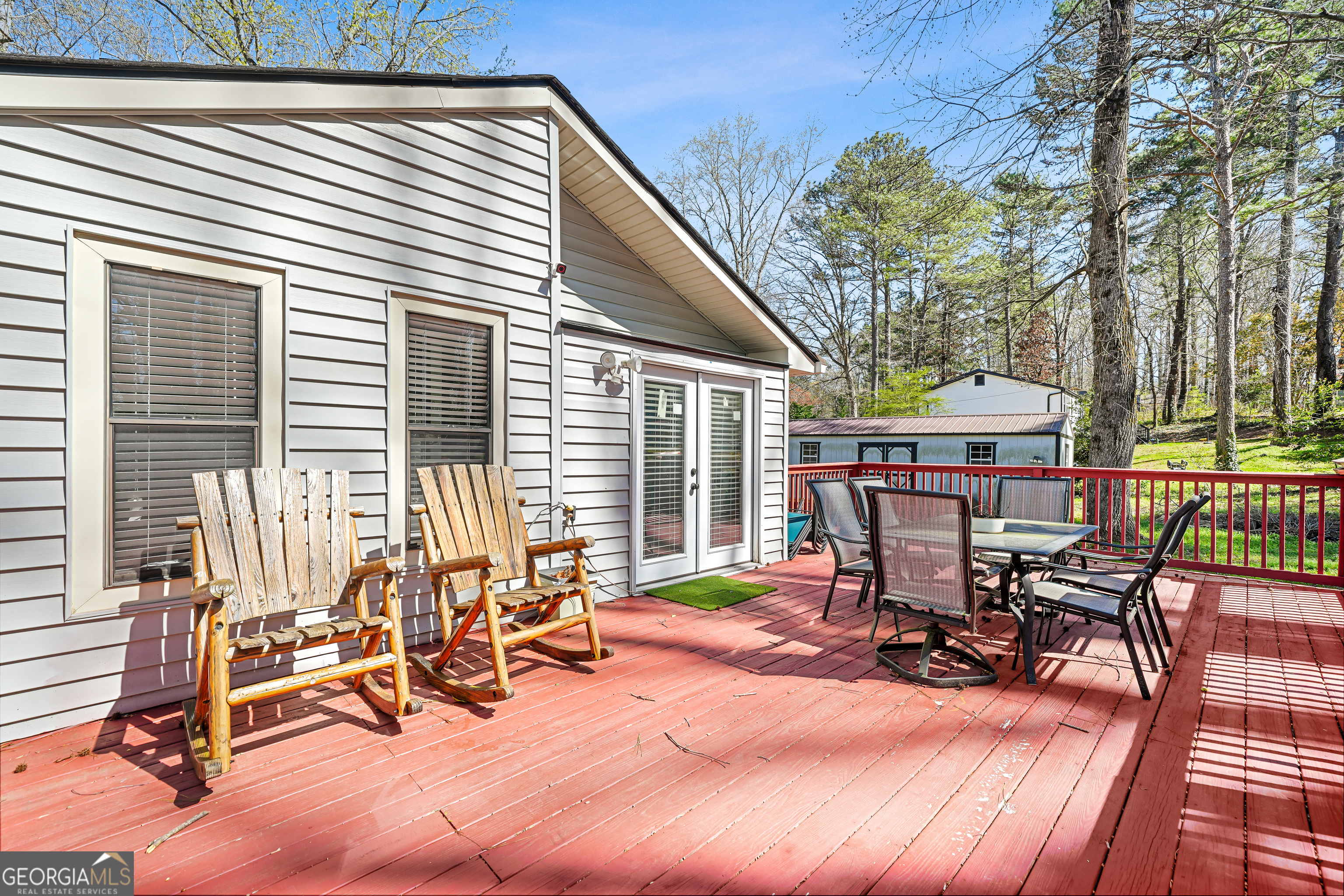 3111 Octavia Lane Snellville, GA 30039 - Photo 41 of 42 a view of a patio with a table chairs and a barbeque
