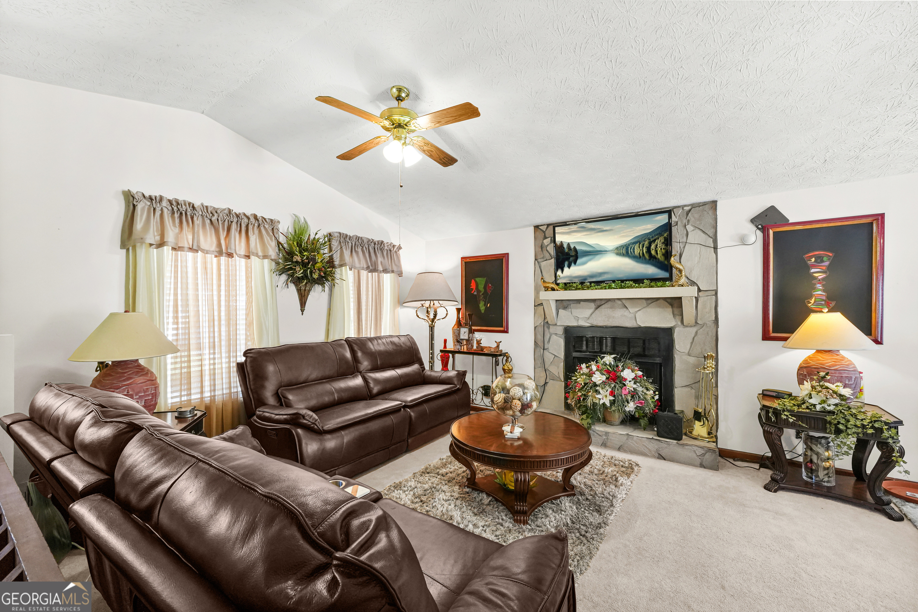 3111 Octavia Lane Snellville, GA 30039 - Photo 7 of 42 a living room with furniture and a fireplace