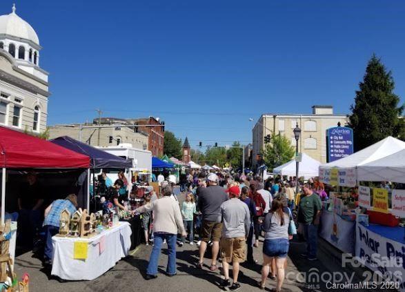 877 Biggerstaff Loop, Unit E Nebo, NC 28761 - Photo 23 of 26 a group of people sitting in front of retail shop