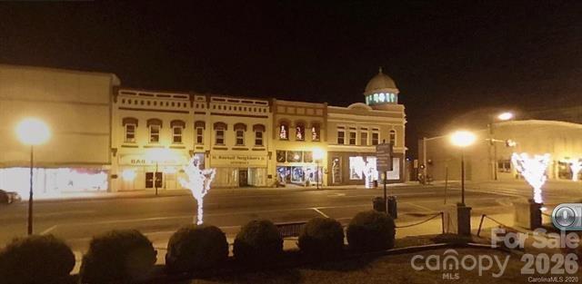 877 Biggerstaff Loop, Unit E Nebo, NC 28761 - Photo 25 of 26 a front view of a building with glass door
