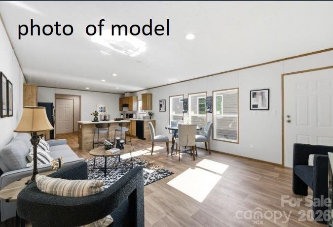 877 Biggerstaff Loop, Unit E Nebo, NC 28761 - Photo 3 of 26 a living room with furniture and a fireplace