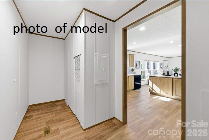 877 Biggerstaff Loop, Unit E Nebo, NC 28761 - Photo 7 of 26 a view of a kitchen with furniture and wooden floor