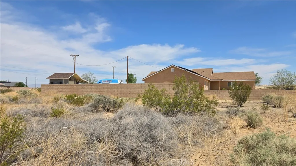 0 Calhoun Drive Edwards, CA 93523 - Photo 21 of 22 a view of a house with a yard