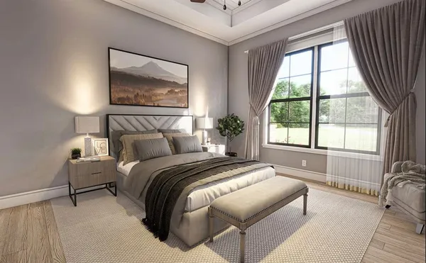 a bedroom with a bed and a large window