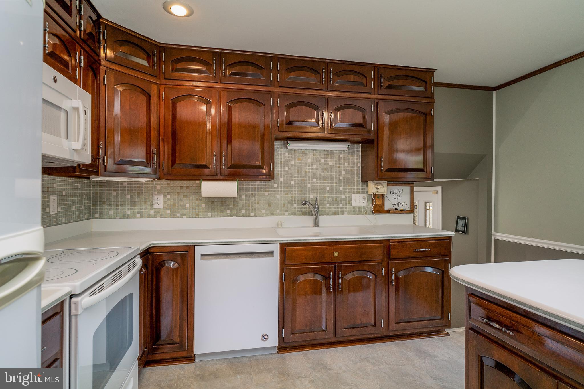 6409 Lochridge Road Columbia, MD 21044 - Photo 8 of 46 Kitchen with custom cabinetry