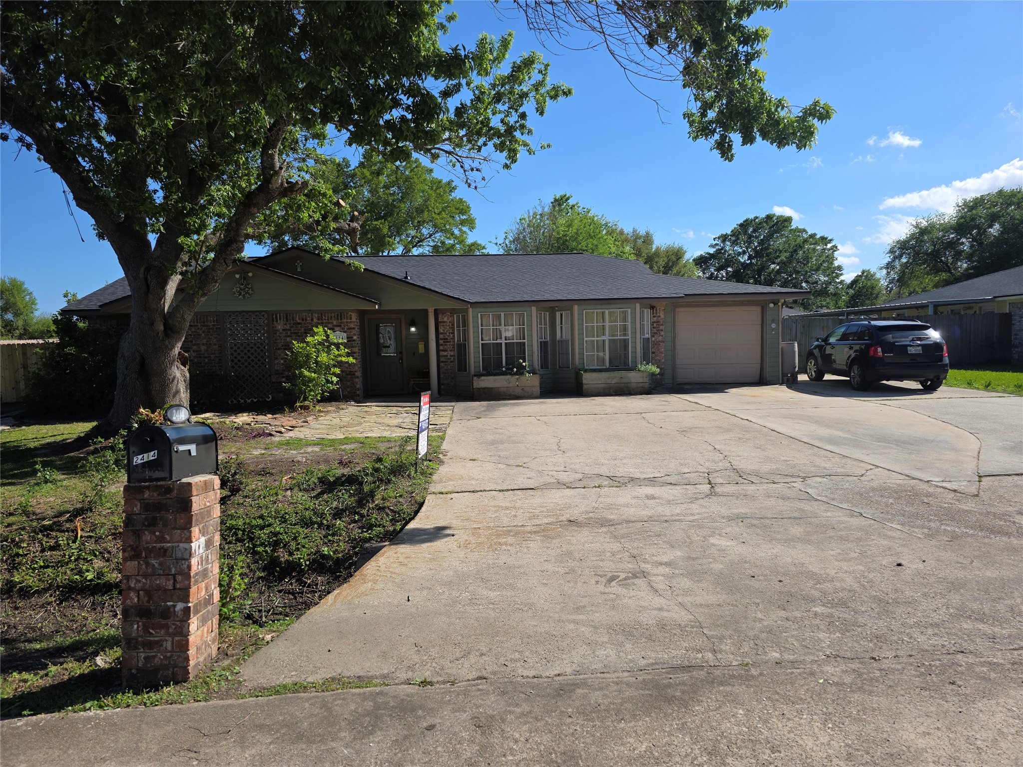 a front view of house with yard outdoor seating and barbeque oven