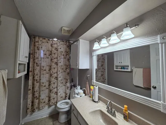 a view of a storage and utility room with washer and dryer