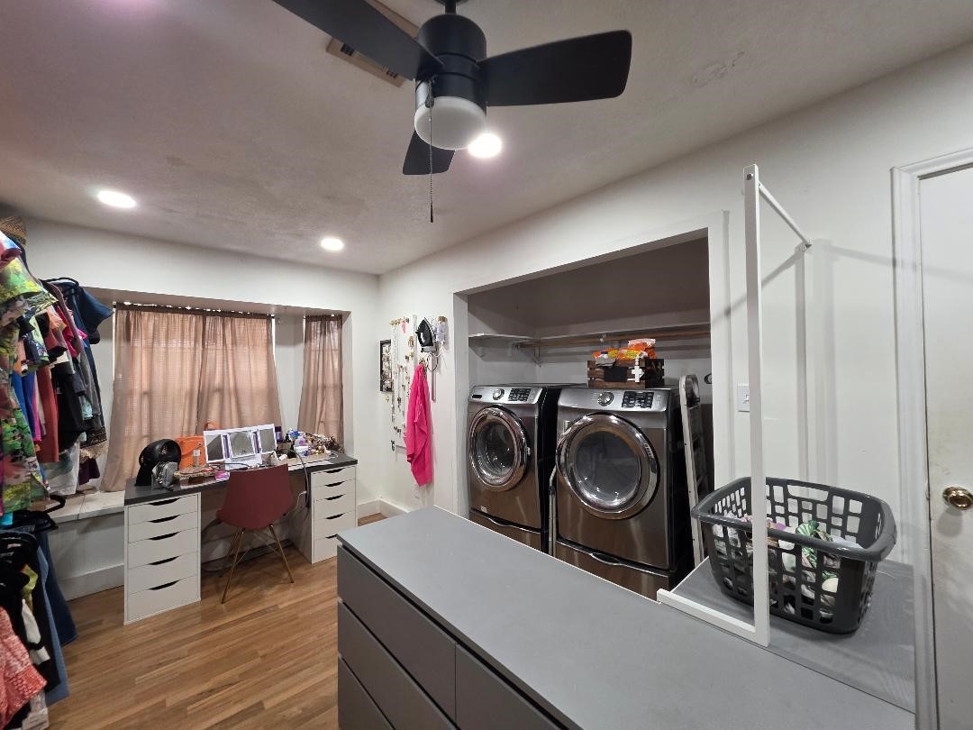 2414 Goldenrod Street Highlands, TX 77562 - Photo 13 of 18 a view of a storage and utility room with washer and dryer