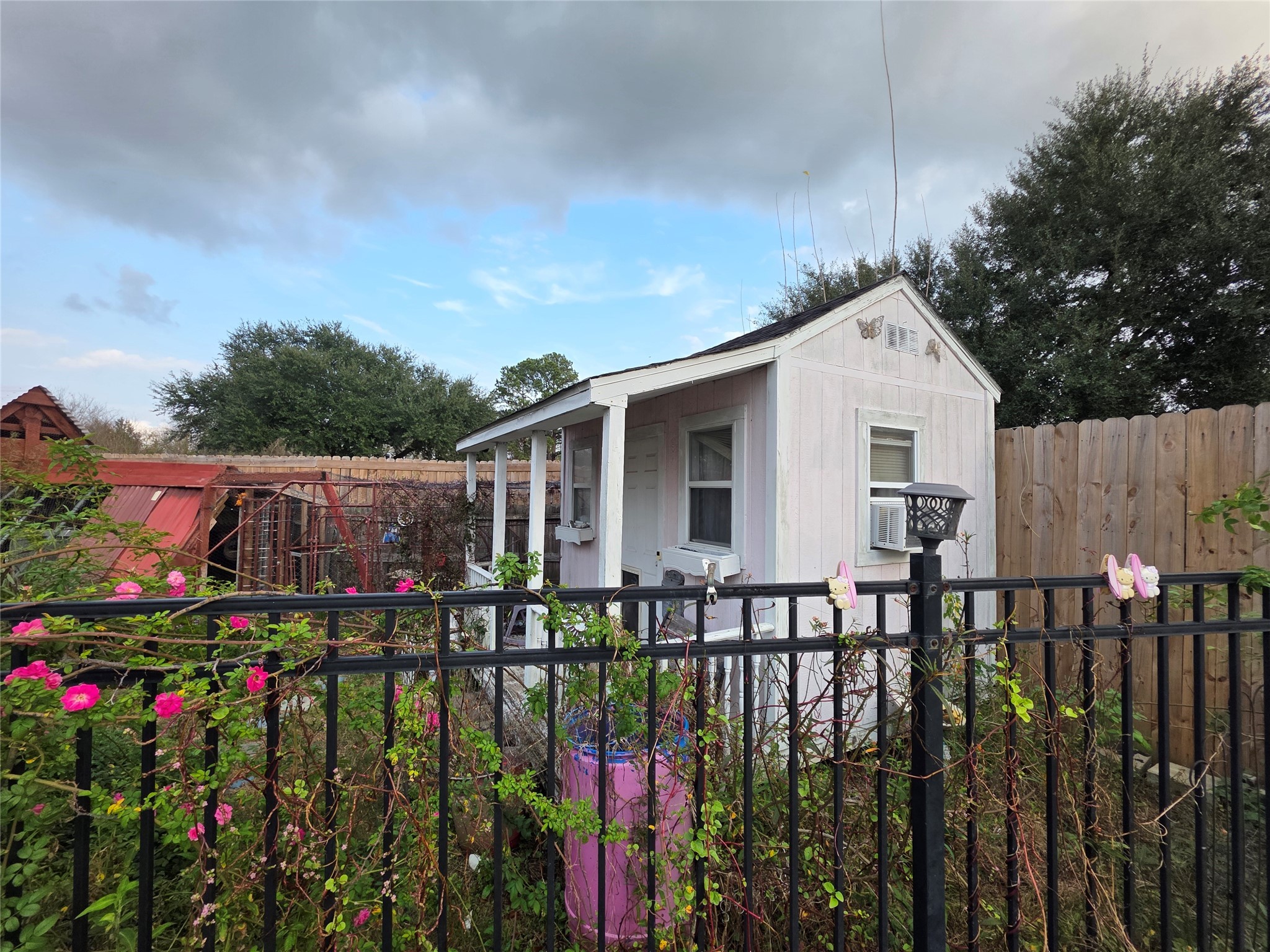 2414 Goldenrod Street Highlands, TX 77562 - Photo 16 of 18 a view of a house with wooden fence