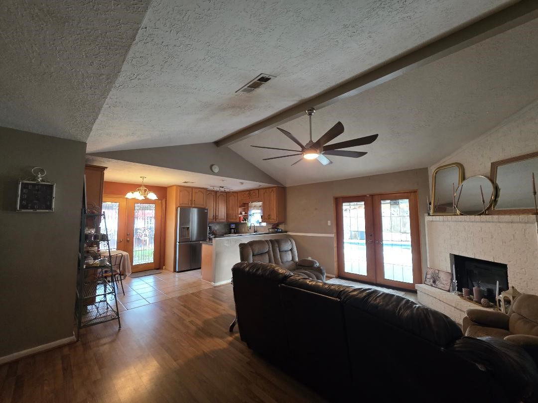 2414 Goldenrod Street Highlands, TX 77562 - Photo 3 of 18 a living room with furniture and a fireplace
