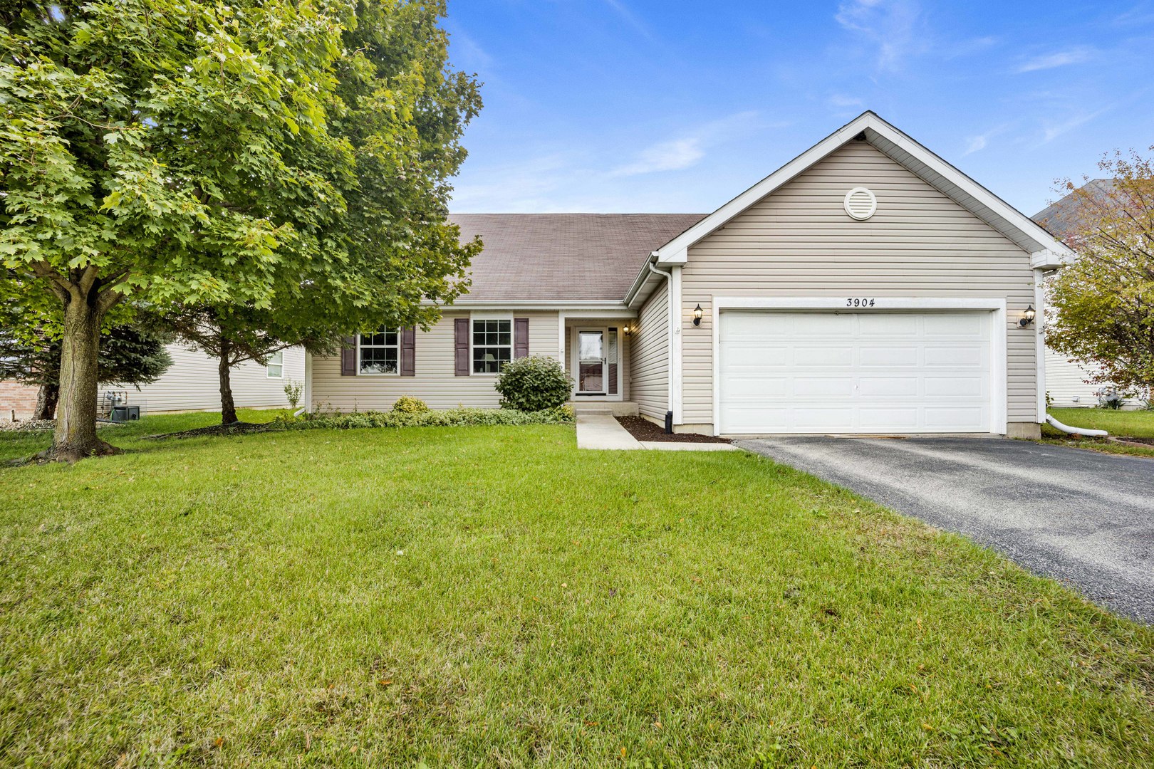 3904 Stockton Drive Joliet, IL 60421 - Photo 1 of 33 a front view of a house with a yard and trees