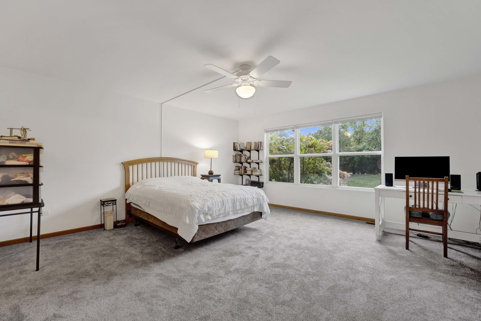 3904 Stockton Drive Joliet, IL 60421 - Photo 18 of 33 a bed sitting in a spacious bedroom next to a window