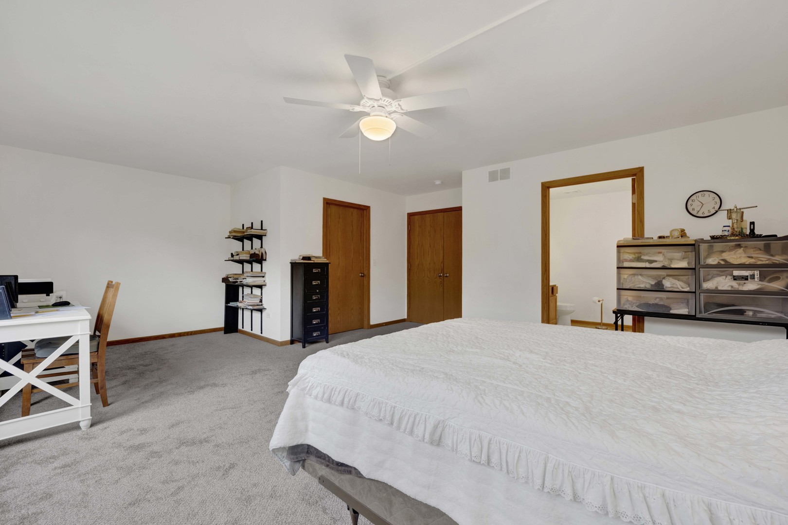 3904 Stockton Drive Joliet, IL 60421 - Photo 21 of 33 a spacious bedroom with a bed and a cabinets
