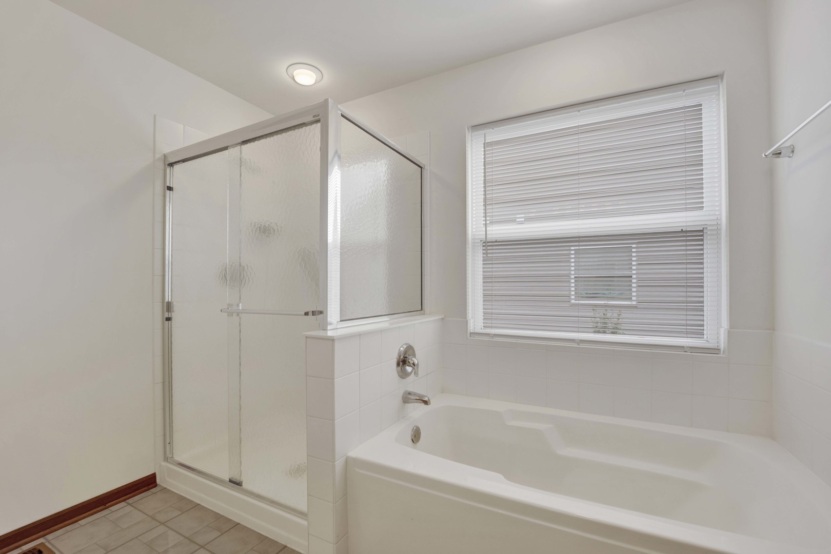 3904 Stockton Drive Joliet, IL 60421 - Photo 23 of 33 a bathroom with a bathtub and a shower