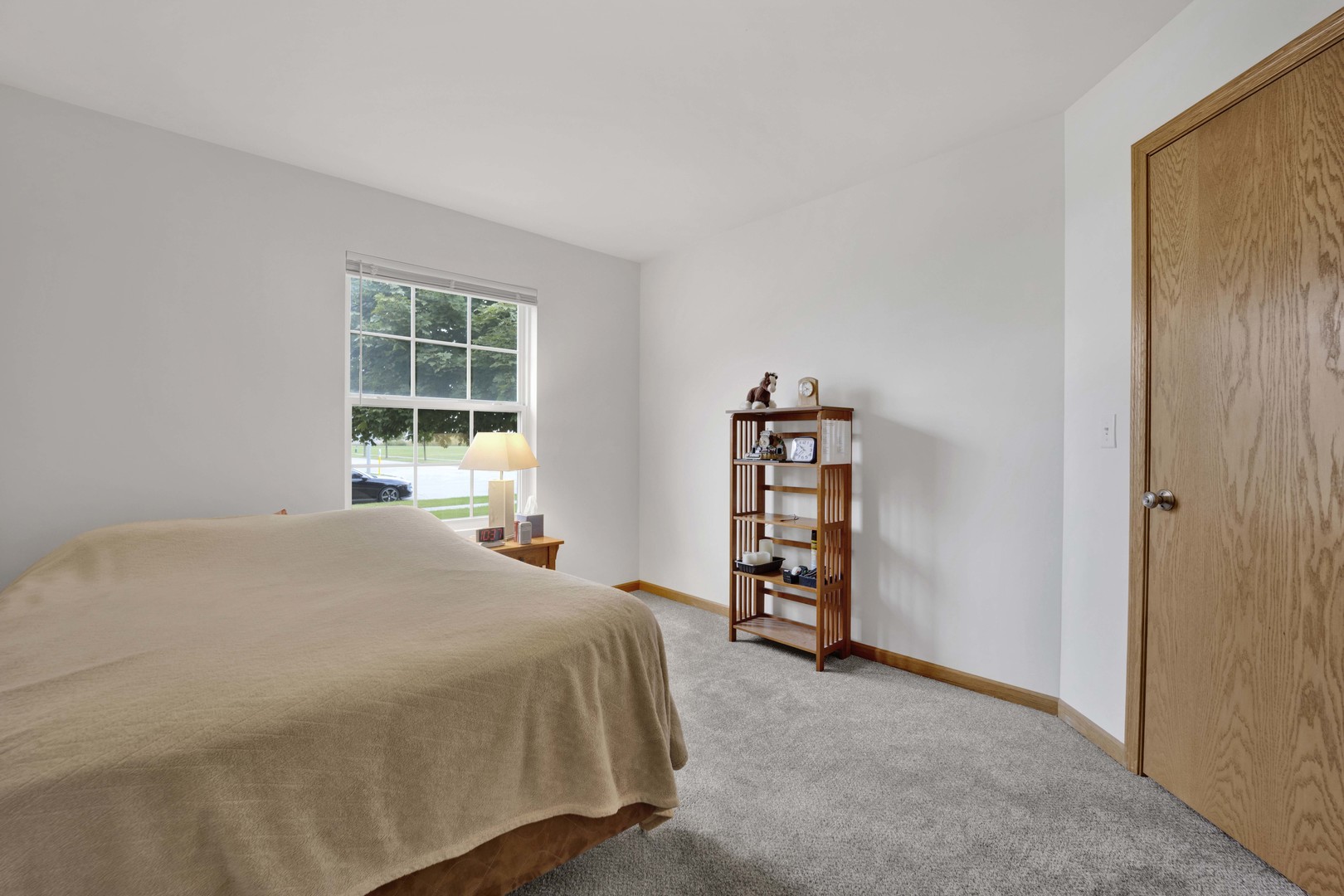 3904 Stockton Drive Joliet, IL 60421 - Photo 24 of 33 a bedroom with a bed and a window