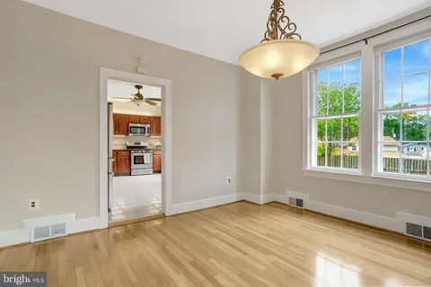 a kitchen with a stove a sink and a microwave