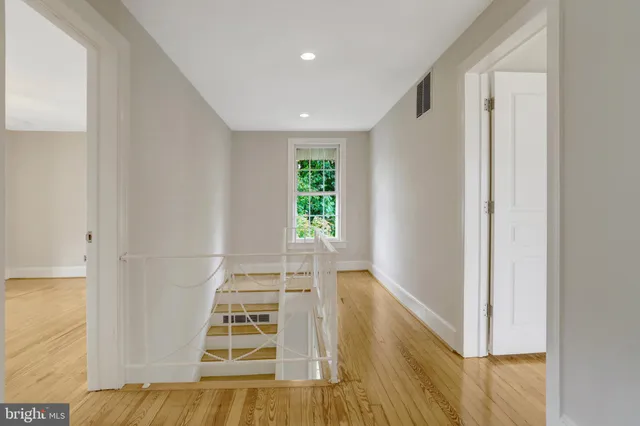 a bathroom with a sink toilet and mirror