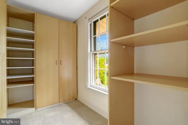 a view of an empty room and wooden floor