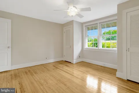a bathroom with a sink double vanity granite tub shower and a mirror