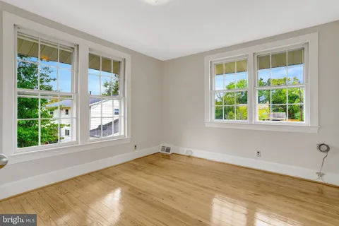 a backyard of a house with outdoor seating
