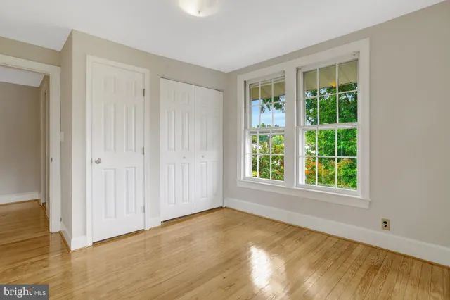 a view of a chairs and table in the back yard of the house