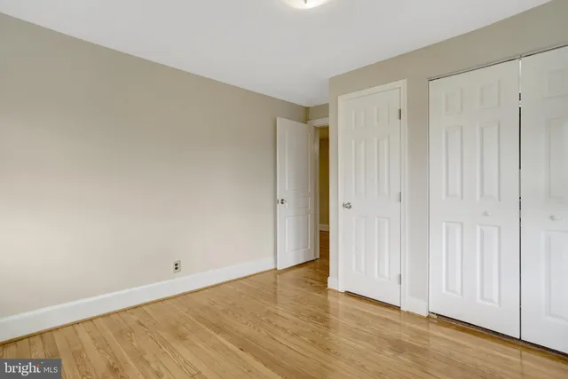 a patio with glass top table and chairs